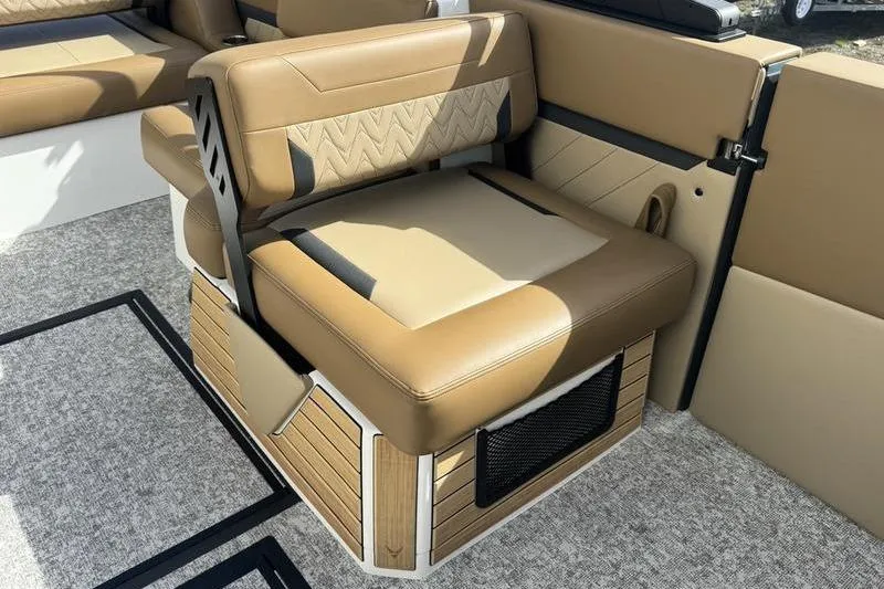 Slide: The Image of Luxurious seating area in 2026 Revel RS25 boat with tan upholstery and built-in speakers. - 15