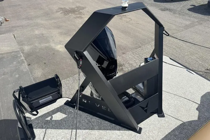 Slide: The Image of 2026 Revel RS25 boat cockpit with beige seating, steering wheel, and control panel. - 9