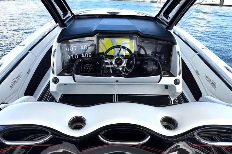 Slide: The Image of Cockpit of 2019 MTI V42 boat with advanced navigation displays and steering wheel. - 15