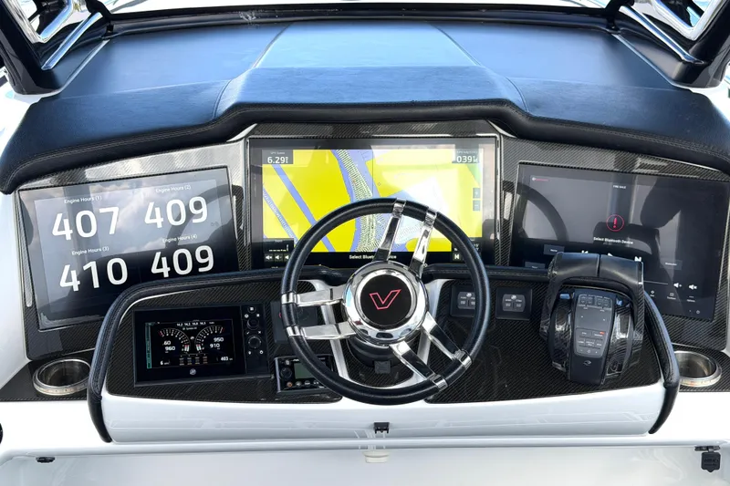Slide: The Image of Dashboard of 2019 MTI V42 boat with navigation and engine displays. - 16