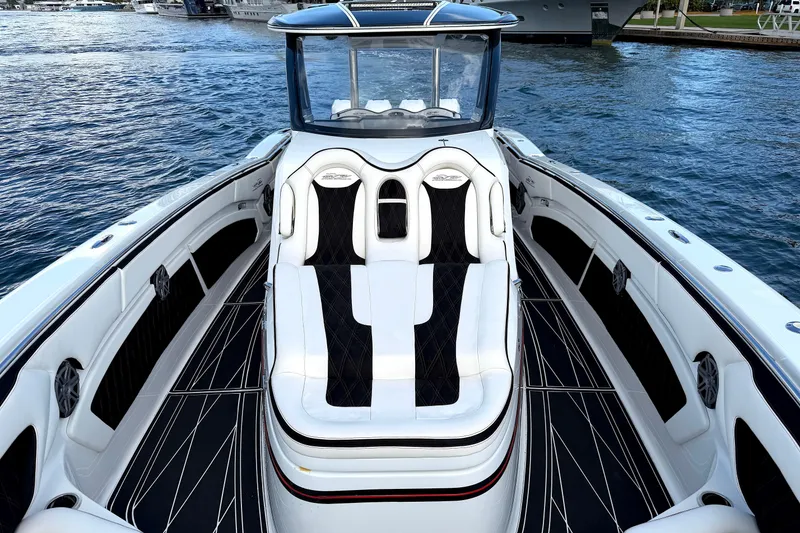 Slide: The Image of Luxurious 2019 MTI V42 boat interior with sleek seating and modern design on the water. - 17