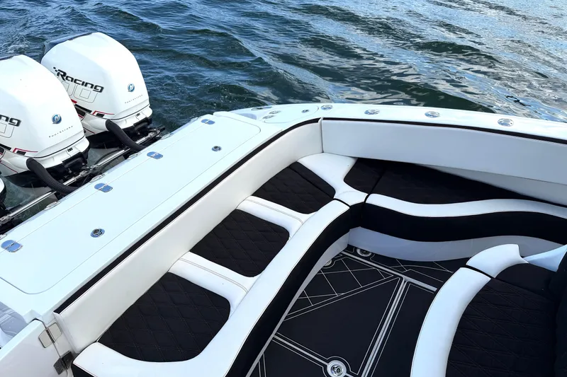 Slide: The Image of Luxury MTI V42 boat interior with twin outboard engines, 2019 model, on water. - 18