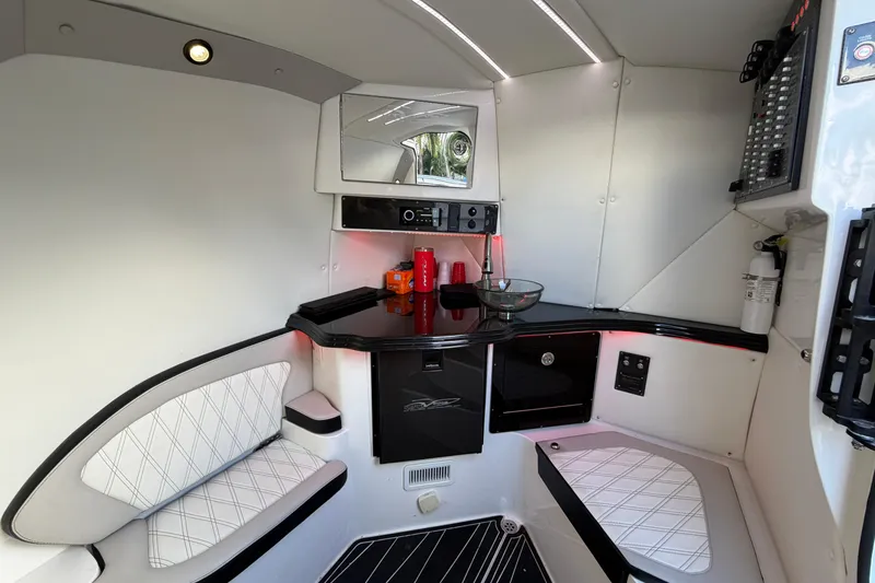 Slide: The Image of Interior of 2019 MTI V42 boat with modern seating, counter, and control panel. - 22