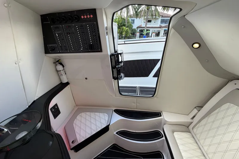 Slide: The Image of Interior of 2019 MTI V42 boat with control panel and seating. - 23