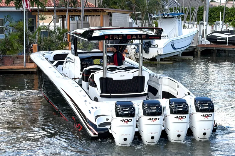 Slide: The Image of 2019 MTI V42 boat with five powerful outboard engines docked in a marina. - 5