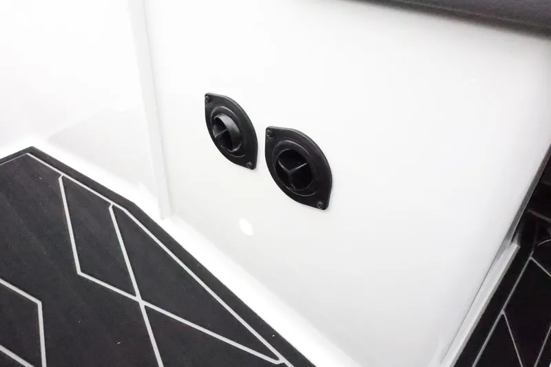Slide: The Image of 2026 ATX Surf Boats 22 Type-S interior detail with black vents and geometric flooring. - 32
