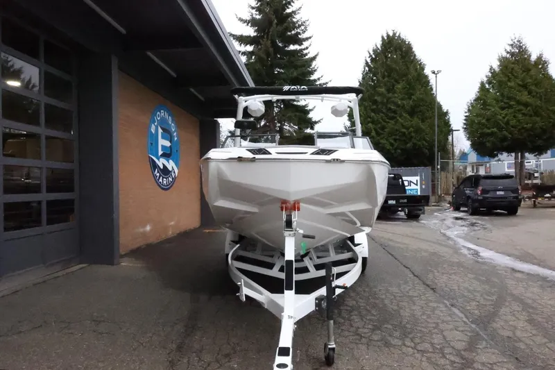 Slide: The Image of 2026 ATX Surf Boats 22 Type-S on trailer outside Bjornson Marine. - 4
