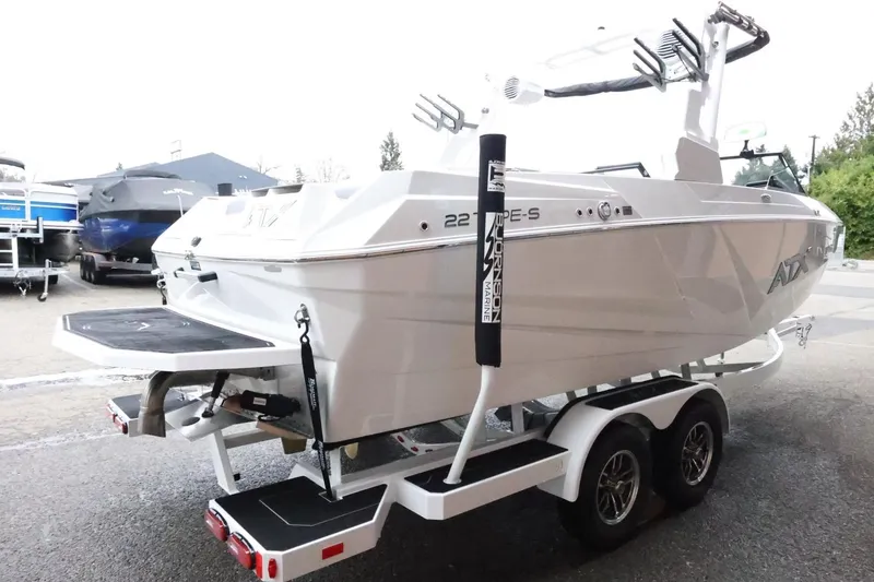 Slide: The Image of 2026 ATX Surf Boats 22 Type-S on trailer, rear view, white exterior. - 6