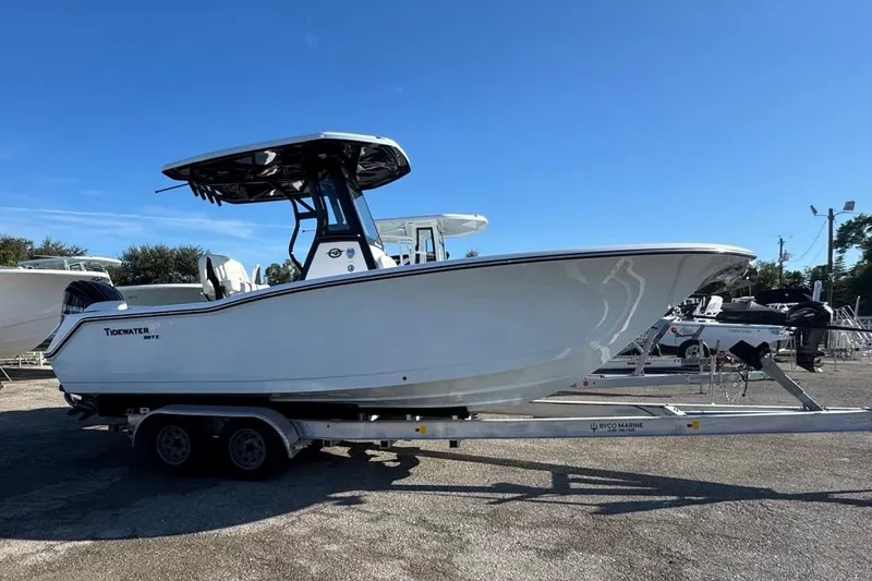 The Image of 2026 Tidewater 232 LXF boat on trailer under clear blue sky. - 0