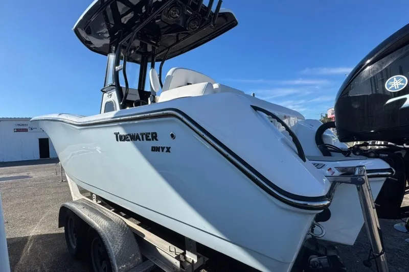 Slide: The Image of 2026 Tidewater 232 LXF boat on trailer, featuring sleek design and modern features. - 4