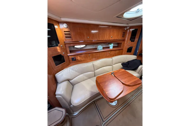 Slide: The Image of 2005 Four Winns 348 Vista boat docked, featuring "El Bandolero" name and North Miami Beach location. - 10