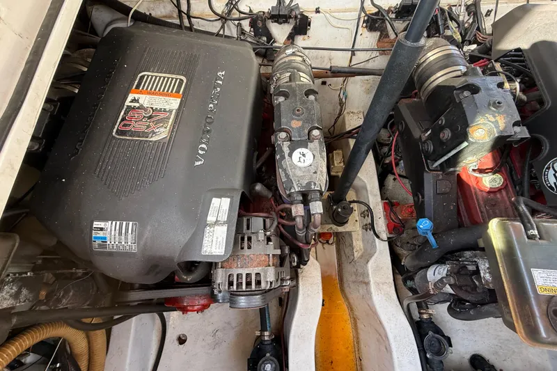 Slide: The Image of Engine compartment of a 2005 Four Winns 348 Vista boat with Volvo Penta components. - 104