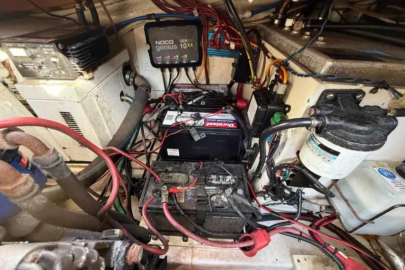 Slide: The Image of Electrical system and battery setup in a 2005 Four Winns 348 Vista boat. - 106