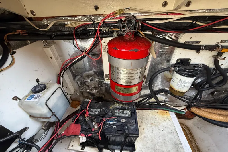 Slide: The Image of Engine compartment of a 2005 Four Winns 348 Vista boat with wiring and fire extinguisher. - 107