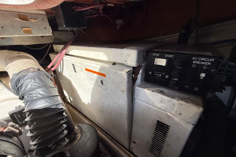 Slide: The Image of 2005 Four Winns 348 Vista engine compartment with AC circuit breaker and wiring. - 110