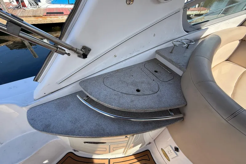 Slide: The Image of 2005 Four Winns 348 Vista boat interior with seating and storage compartments. - 26