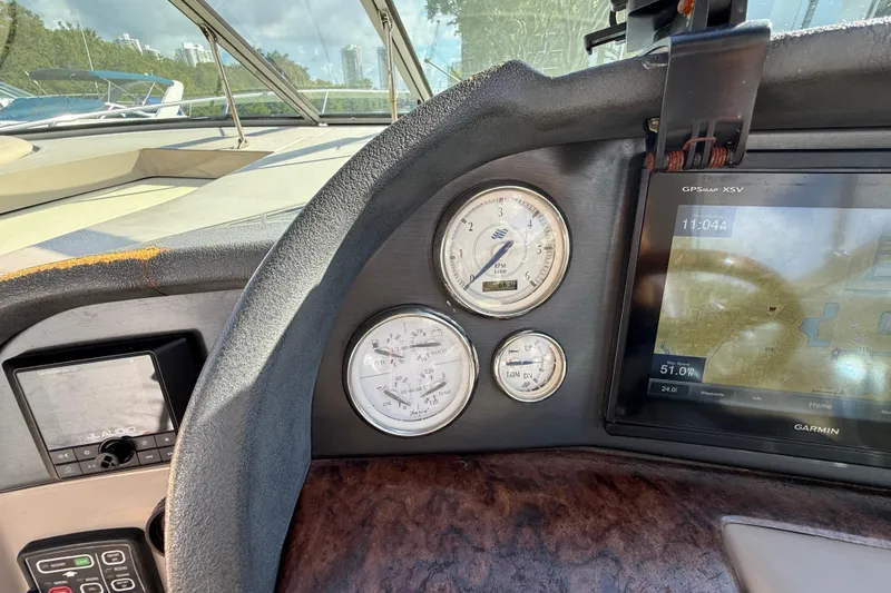 Slide: The Image of Dashboard of a 2005 Four Winns 348 Vista boat with gauges and GPS display. - 35