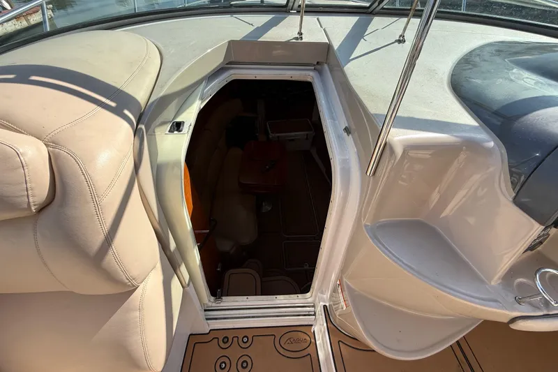 Slide: The Image of 2005 Four Winns 348 Vista boat interior entrance with beige seating and steps. - 44