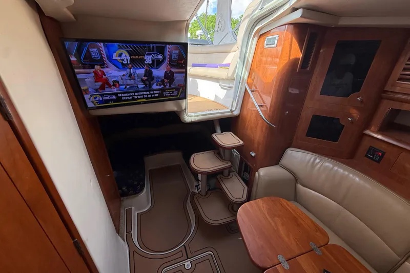 Slide: The Image of Interior of 2005 Four Winns 348 Vista yacht with TV and seating area. - 69