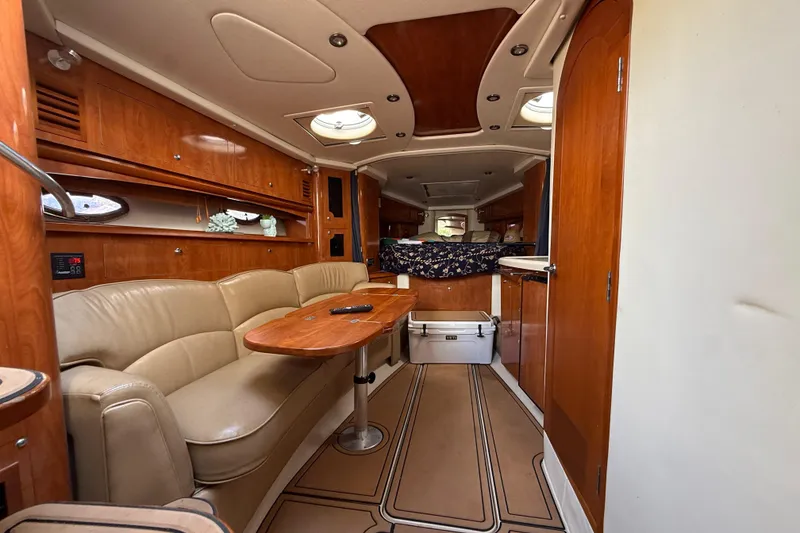 Slide: The Image of Luxurious interior of 2005 Four Winns 348 Vista yacht with wood finishes and cozy seating. - 74