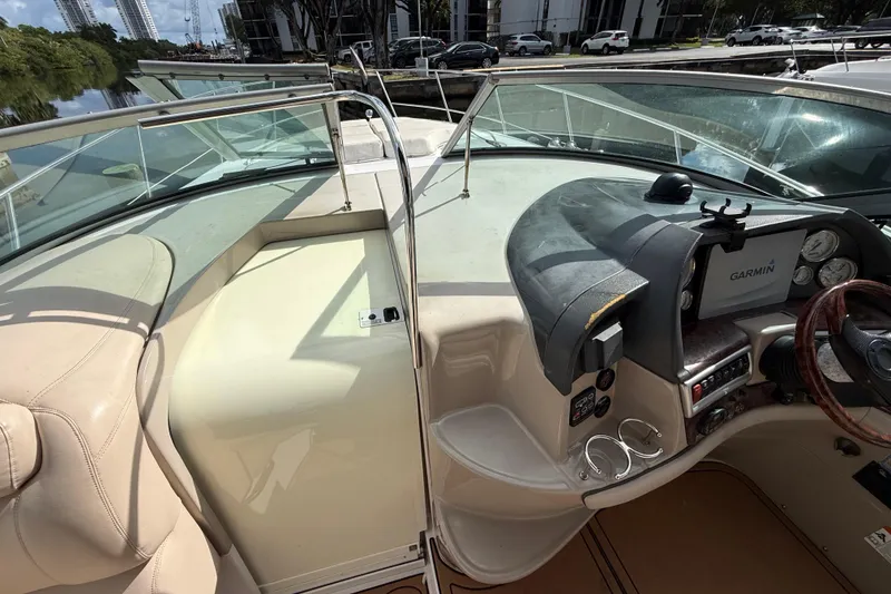 Slide: The Image of 2005 Four Winns 348 Vista boat cockpit with Garmin navigation system and leather seating. - 77