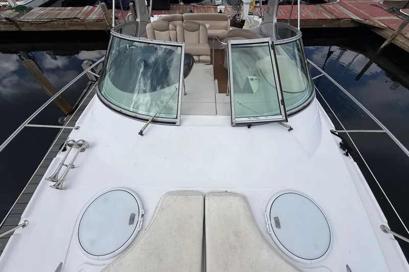 Slide: The Image of 2005 Four Winns 348 Vista boat deck with open windshield and seating area. - 90