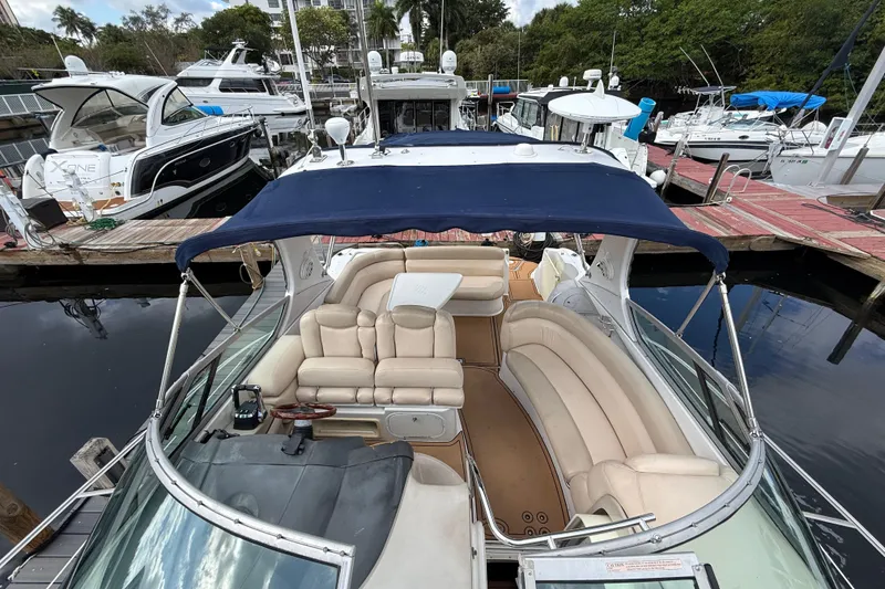 Slide: The Image of 2005 Four Winns 348 Vista yacht with spacious seating at a marina. - 94