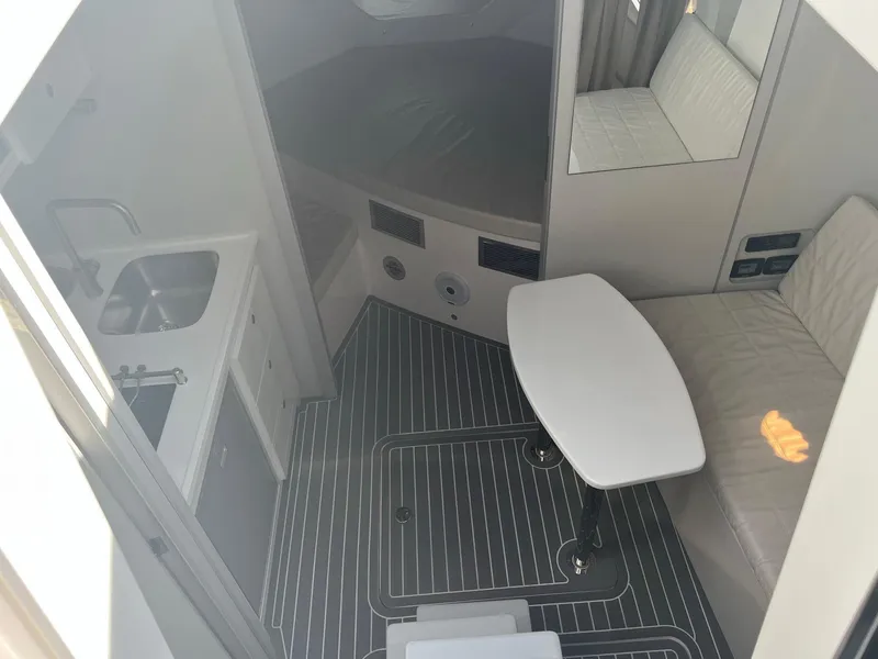 Slide: The Image of Interior of 2021 Evolve 400HT yacht, featuring sleek seating and modern design elements. - 18