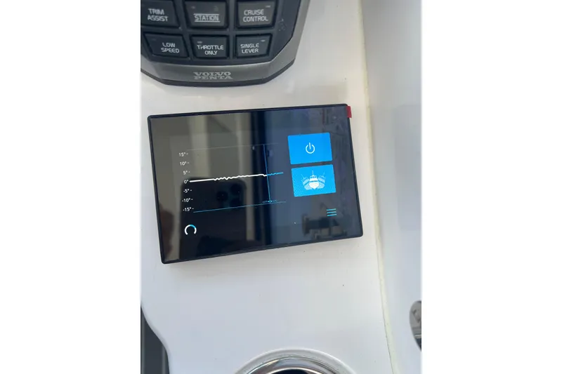 Slide: The Image of Dashboard of 2021 Evolve 400HT yacht with navigation and control panels. - 2