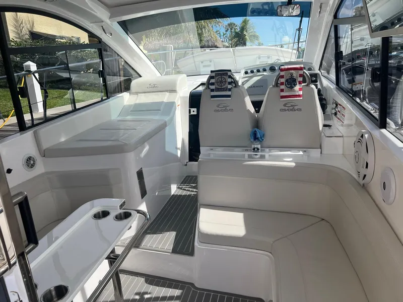 Slide: The Image of Interior of 2021 Evolve 400HT yacht with modern dashboard and large window view. - 20