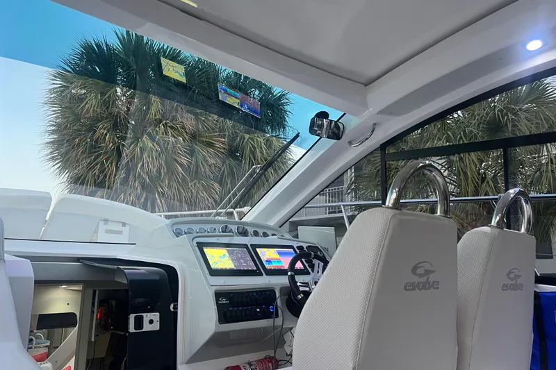 Slide: The Image of 2021 Evolve 400HT yacht docked at marina under a vibrant sky. - 25