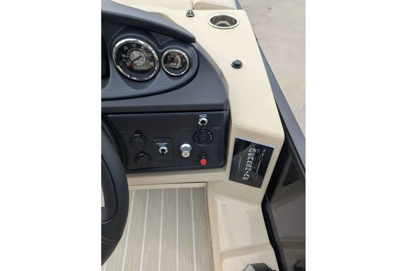 Slide: The Image of 2026 Berkshire 24UL CTS boat dashboard with gauges and controls. - 13