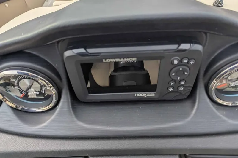 Slide: The Image of Dashboard of 2026 Berkshire 24UL CTS with Lowrance Hook display and gauges. - 15