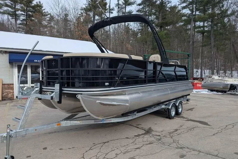 Slide: The Image of 2026 Berkshire 24UL CTS pontoon boat on trailer, parked outdoors in winter setting. - 5