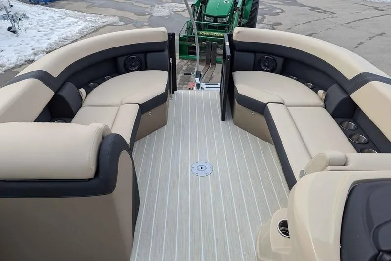 Slide: The Image of 2026 Berkshire 24UL CTS pontoon boat interior with beige and black seating. - 9