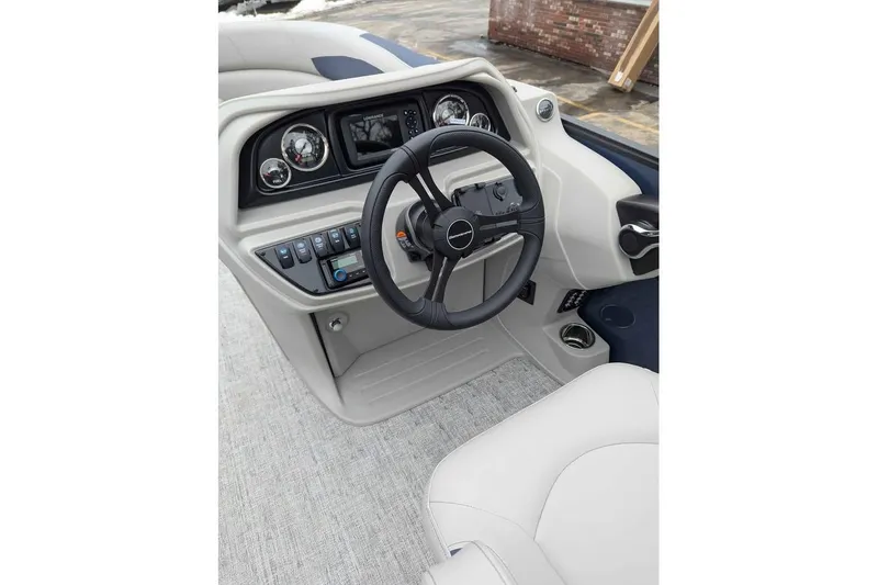 Slide: The Image of 2026 Berkshire 22CL2 LE boat dashboard with steering wheel and control panel. - 11