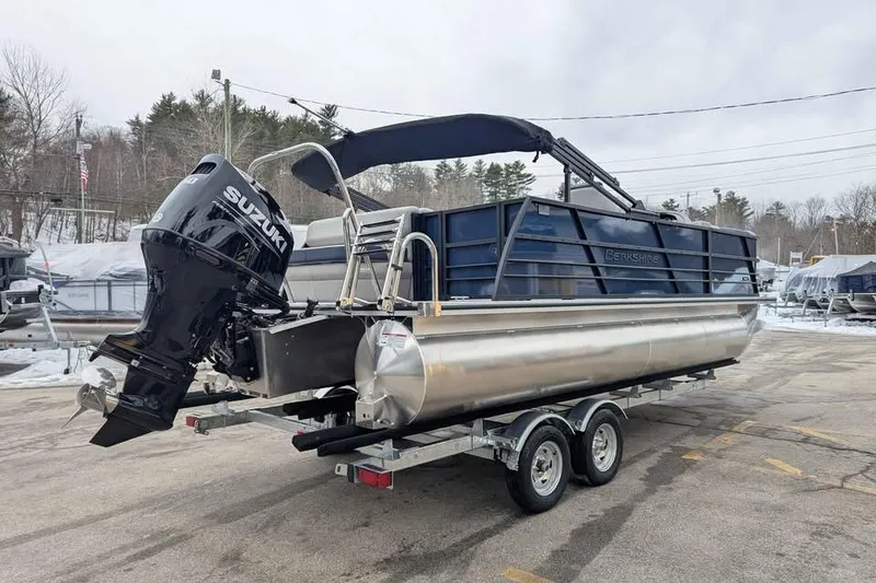 Slide: The Image of 2026 Berkshire 22CL2 LE pontoon boat with Suzuki outboard motor on trailer. - 2