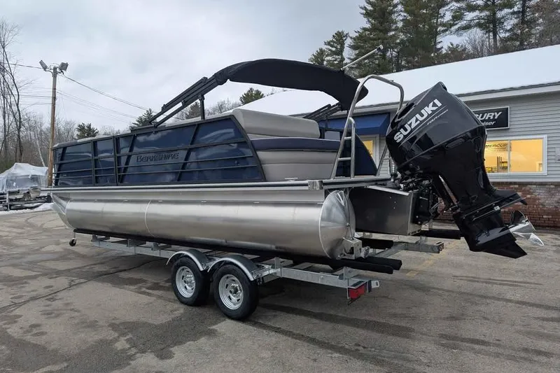 Slide: The Image of 2026 Berkshire 22CL2 LE pontoon boat with Suzuki outboard motor on trailer. - 3