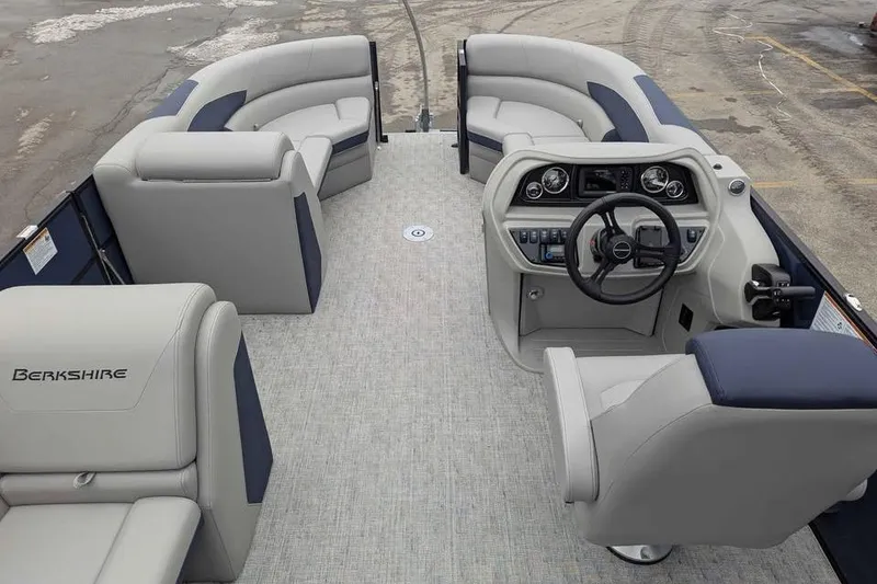 Slide: The Image of 2026 Berkshire 22CL2 LE pontoon boat interior with plush seating and modern helm. - 9