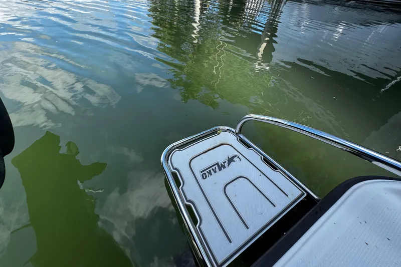 Slide: The Image of 2018 Mako 204 Center Console boat platform on calm water. - 16