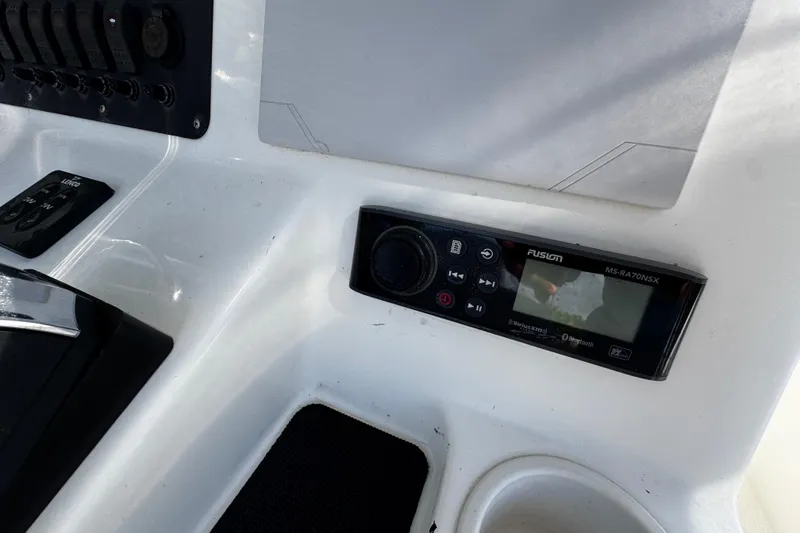 Slide: The Image of 2018 Mako 204 Center Console dashboard with Fusion MS-RA70NSX stereo system. - 21