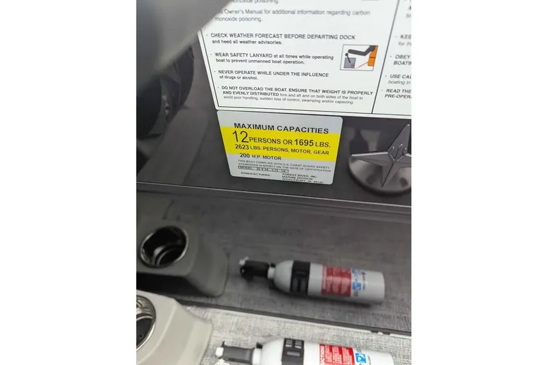 Slide: The Image of 2026 Berkshire 24RFX LE capacity label, maximum 12 persons or 1695 lbs, 200 HP motor. - 16