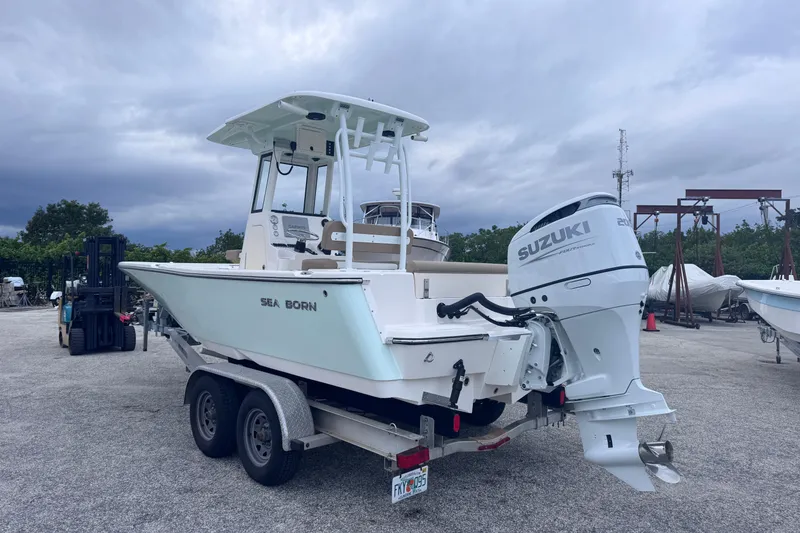 Slide: The Image of 2026 Sea Born LX22 Center Console boat with Suzuki engine on trailer. - 4