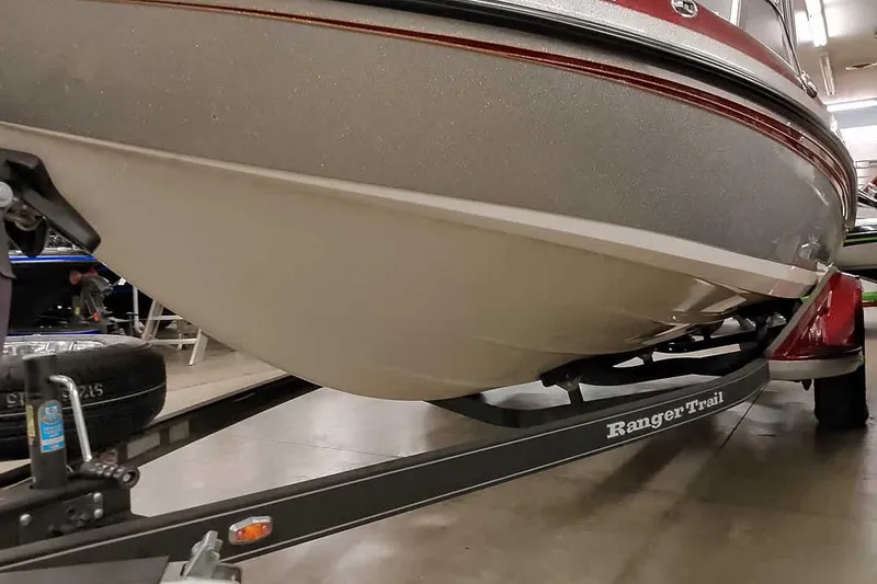 Slide: The Image of 2020 Ranger 1850MS Reata boat on Ranger Trail trailer in showroom. - 12