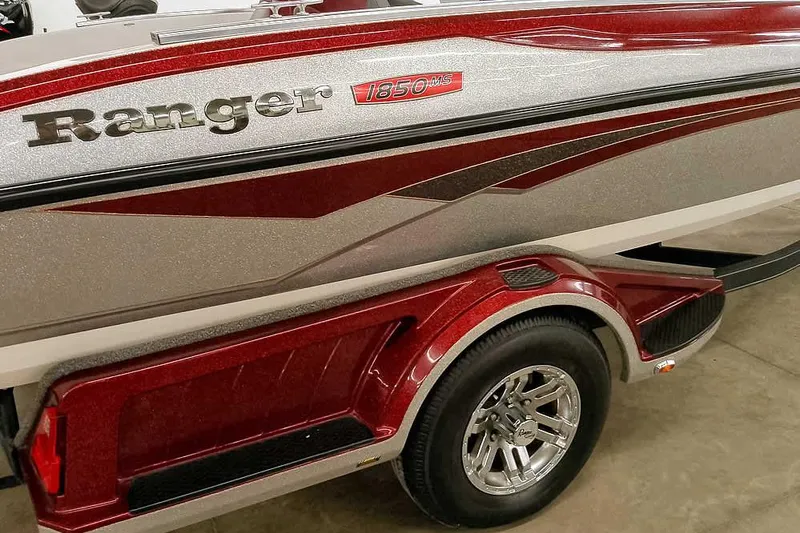 Slide: The Image of 2020 Ranger 1850MS Reata boat with red and silver detailing on trailer. - 19