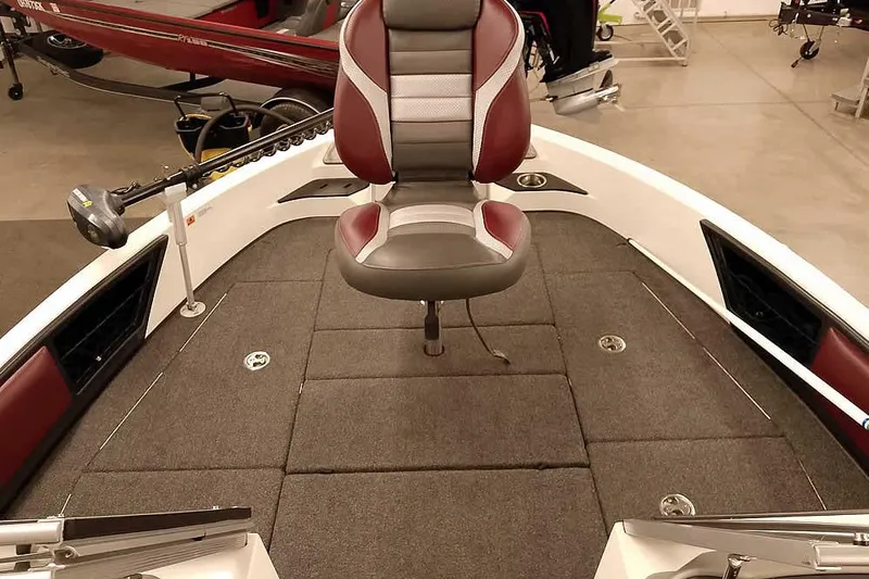 Slide: The Image of 2020 Ranger 1850MS Reata boat interior with cushioned seat and carpeted deck. - 23