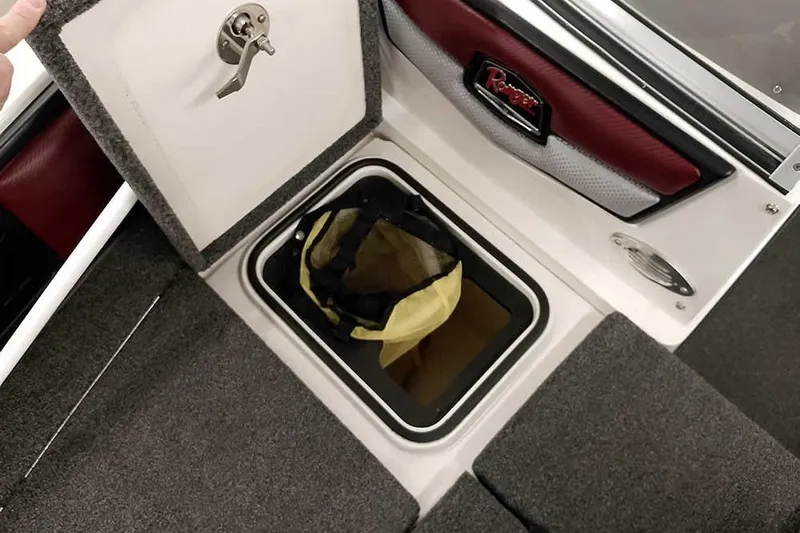 Slide: The Image of 2020 Ranger 1850MS Reata boat storage compartment with open lid and visible bag. - 26