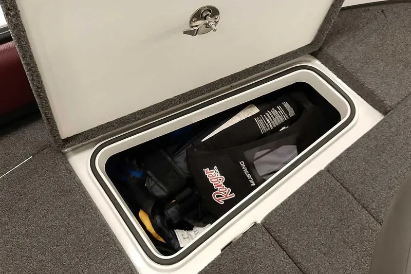 Slide: The Image of Storage compartment in 2020 Ranger 1850MS Reata boat, containing life jacket and gear. - 29