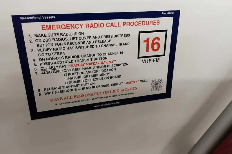Slide: The Image of Emergency radio call procedures sign on a 2020 Ranger 1850MS Reata boat. - 36