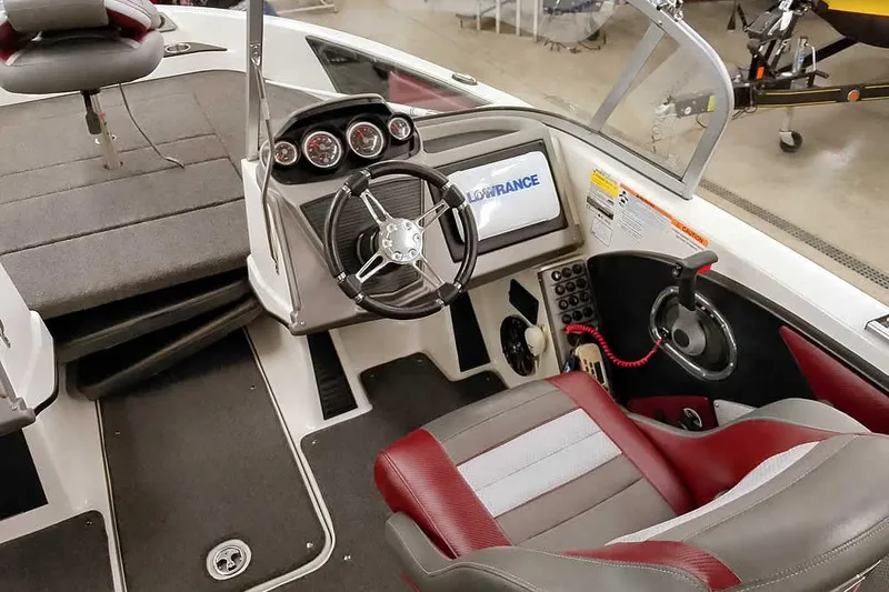 Slide: The Image of 2020 Ranger 1850MS Reata boat interior with steering wheel and dashboard controls. - 38